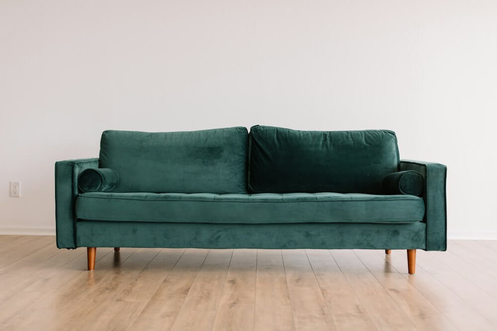 Furniture showroom with a green velvet sofa